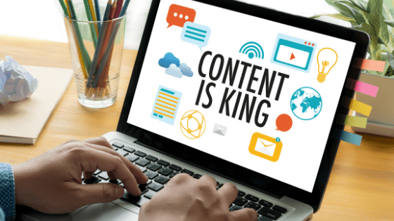LAPTOP READS "CONTENT IS KING", referring to search engine optimization